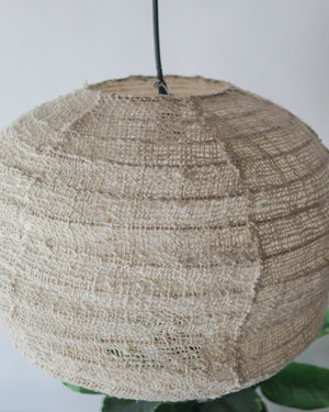 Cotton chandelier lantern in pumpkin shape, handmade in Bali, Indonesia, featuring unique design and natural linen texture.