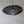 Modern handmade black mesh pendant light with exposed bulb against white wall