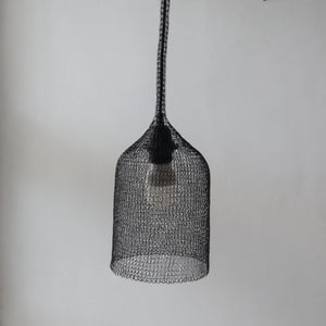 Handmade black wire mesh pendant light with minimalist modern design on white background