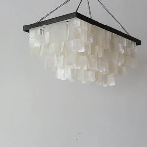 Rectangular seashell chandelier with layered white capiz shells and black frame