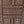 Hand-carved Balinese wooden door with intricate geometric patterns