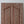 Hand-carved Balinese wooden door panel with intricate geometric patterns