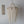 Handmade Balinese seashell chandelier with draped beads, boho wall art on white background