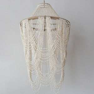 Handmade Balinese seashell chandelier with cascading beads, luxury boho home decor