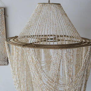 Handmade Balinese seashell chandelier with natural woven details, boho home decor