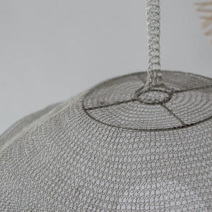 Handmade wire mesh pendant lampshade with intricate metal craftsmanship