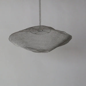 Handmade woven wire pendant light with organic shape, minimalist home decor