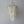 Handmade Balinese seashell chandelier with layered shell strands against a neutral wall