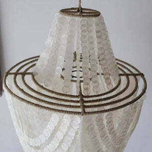 Handmade Balinese seashell chandelier with natural rope accents on a metal frame