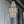 Handmade Balinese beaded chandelier with natural wood beads hanging outdoors