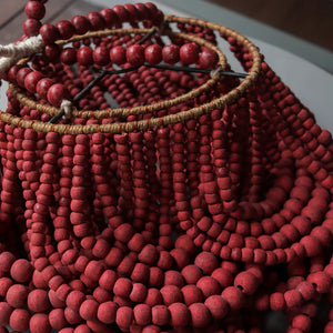 Handmade red wood bead chandelier with rustic boho style for home decor