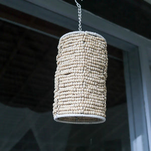Handcrafted beaded pendant light with natural wood beads, hanging indoors