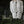 Handmade white bead chandelier in natural outdoor setting, Balinese decor accent