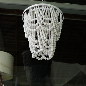 Handmade seashell beaded chandelier with cascading white strands, eco-friendly home decor
