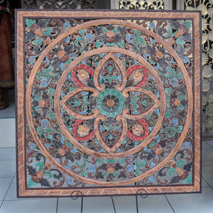 Hand-carved Balinese wood wall panel with intricate floral and mandala patterns