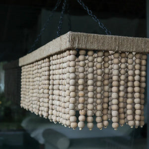 Rectangular beaded chandelier with natural wood beads, hanging from black metal chains