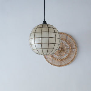 Handcrafted seashell globe pendant light with woven rattan wall decor, boho coastal home lighting