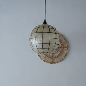 Handcrafted seashell globe pendant light with woven rattan accent, eco-friendly Balinese home decor
