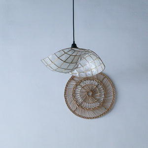 Handcrafted seashell pendant light with woven rattan spiral wall decor, Balinese home accent