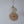 Handcrafted seashell pendant light with geometric design, paired with woven rattan wall art for boho home decor