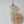 Handcrafted mother-of-pearl pendant light with gold grid, paired with woven rattan wall decor