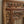 Hand-carved Balinese wooden door with intricate floral and leaf patterns