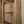 Hand-carved Balinese wooden door with intricate floral detailing and natural finish