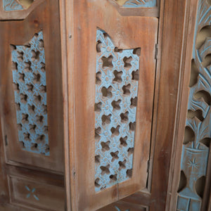 Hand-carved wooden door panel with blue floral lattice design, Balinese decor