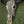 Hand-carved buffalo skull with intricate Balinese patterns on grass background