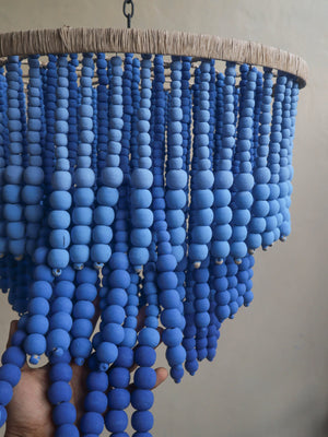 Handmade blue beaded chandelier with natural fiber frame, artisan home decor