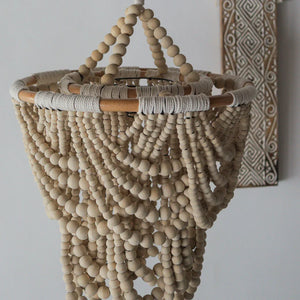 Handmade wooden bead chandelier with natural finish and boho home decor accents