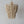 Handcrafted wooden beaded chandelier with natural finish, hanging against a white wall