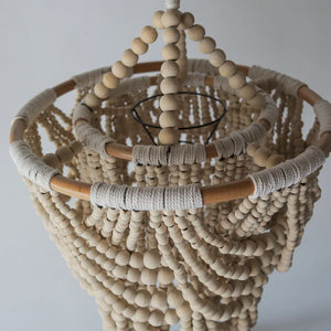 Handmade wooden bead chandelier with woven rope detail, natural boho home decor
