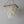 Handmade rectangular seashell chandelier with cascading natural shell pieces on white wall