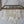 Handmade seashell chandelier with cascading white shell pieces and metal frame