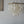 Square tiered seashell chandelier with natural capiz shells, hanging in a modern room
