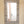 Hand-carved Balinese mirror with intricate geometric patterns, rustic wall decor