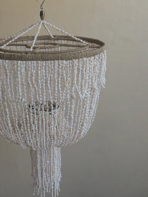 Handmade Balinese seashell chandelier with layered white shell strands and rope accents