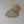 Handcrafted rattan pendant light with woven wall decor on a neutral background