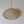 Handwoven rattan pendant light with natural finish, hanging against a white wall