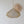 Handwoven natural fiber pendant lamp with a unique organic shape, hanging beside woven wall art