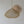 Handwoven natural fiber pendant light with a unique scalloped shape, minimal decor background