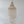 Handmade Balinese seashell chandelier with layered spiral design against white wall