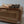 Hand-carved wooden furniture with woven rattan panel and ornate Balinese detail