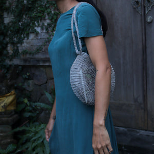 Wire Mesh Hand Woven Bag Ratna being carried in a casual setting, showcasing its unique handwoven design.