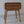 Hand-carved wooden nightstand with rattan drawer and intricate Balinese patterns