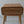 Hand-carved wooden nightstand with rattan drawer and intricate Balinese floral details