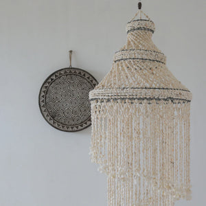 Handmade seashell chandelier with cascading strands, modern decor, round tribal wall art
