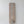 Hand-carved wooden wall art with intricate Balinese geometric patterns on a white wall