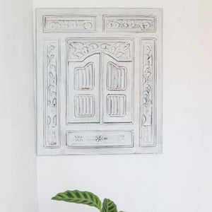 Hand-carved white Balinese wooden wall decor panel with intricate floral patterns